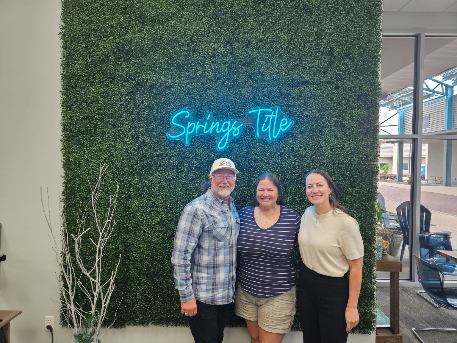 David Coker celebrating with clients at Springs Title